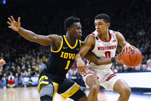 Garza, No. 18 Iowa rally to beat Wisconsin 68-62